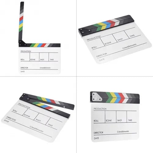Claqueta de cine en acrílico blanco con colores en la parte superior.